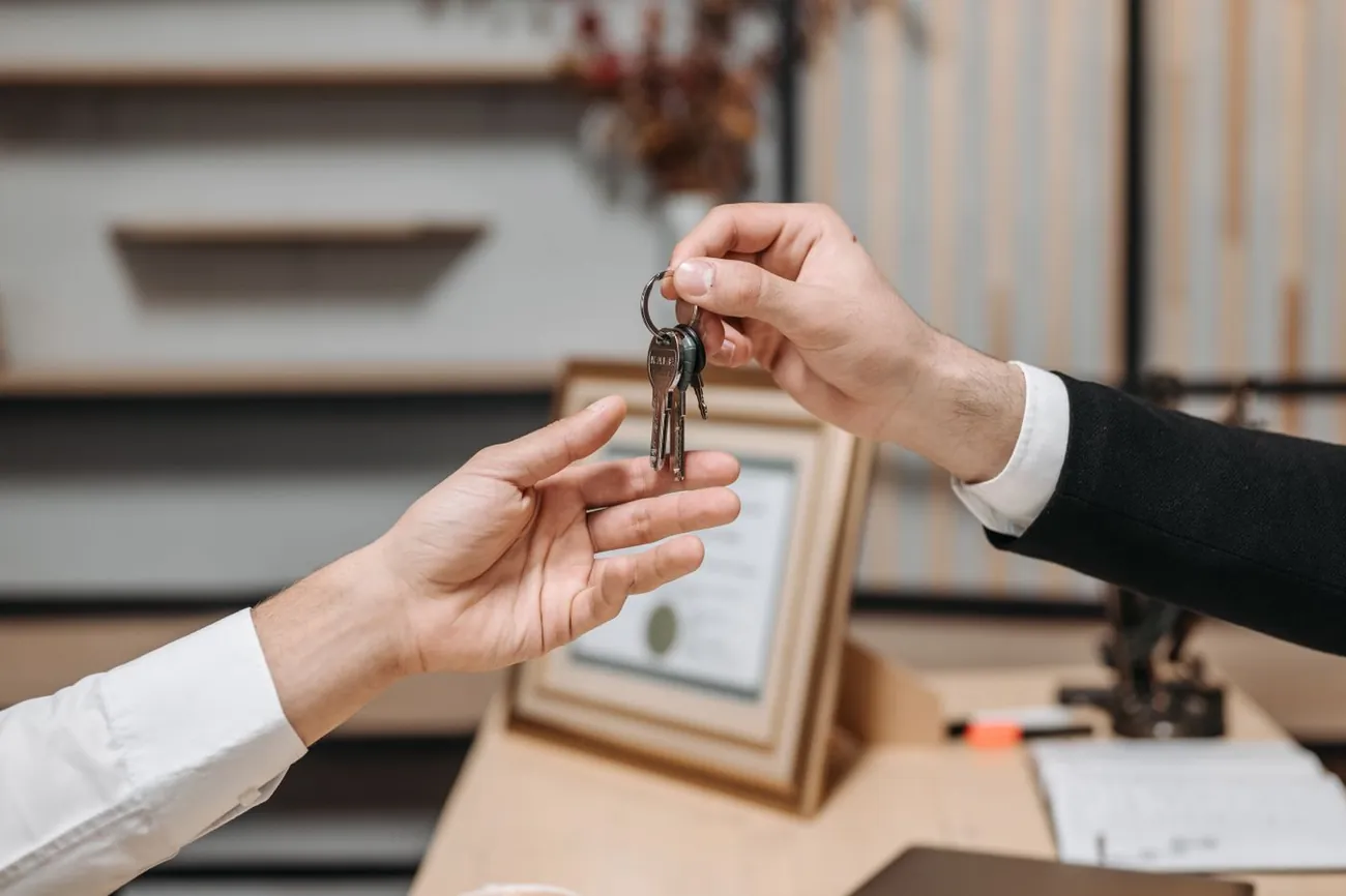 Handing over the keys to a newly placed tenant